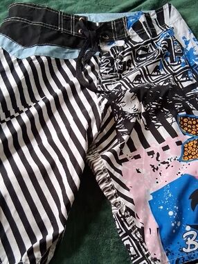 Asphalt Men’s Black and White Striped Swim Trunks with Blue and Pink Graphic